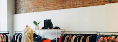 Overtrading article cover image featuring an apparel shop with brick wall and white panel