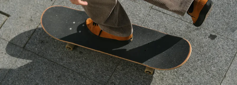 Person riding a skateboard on pavement illustrating cash flow management