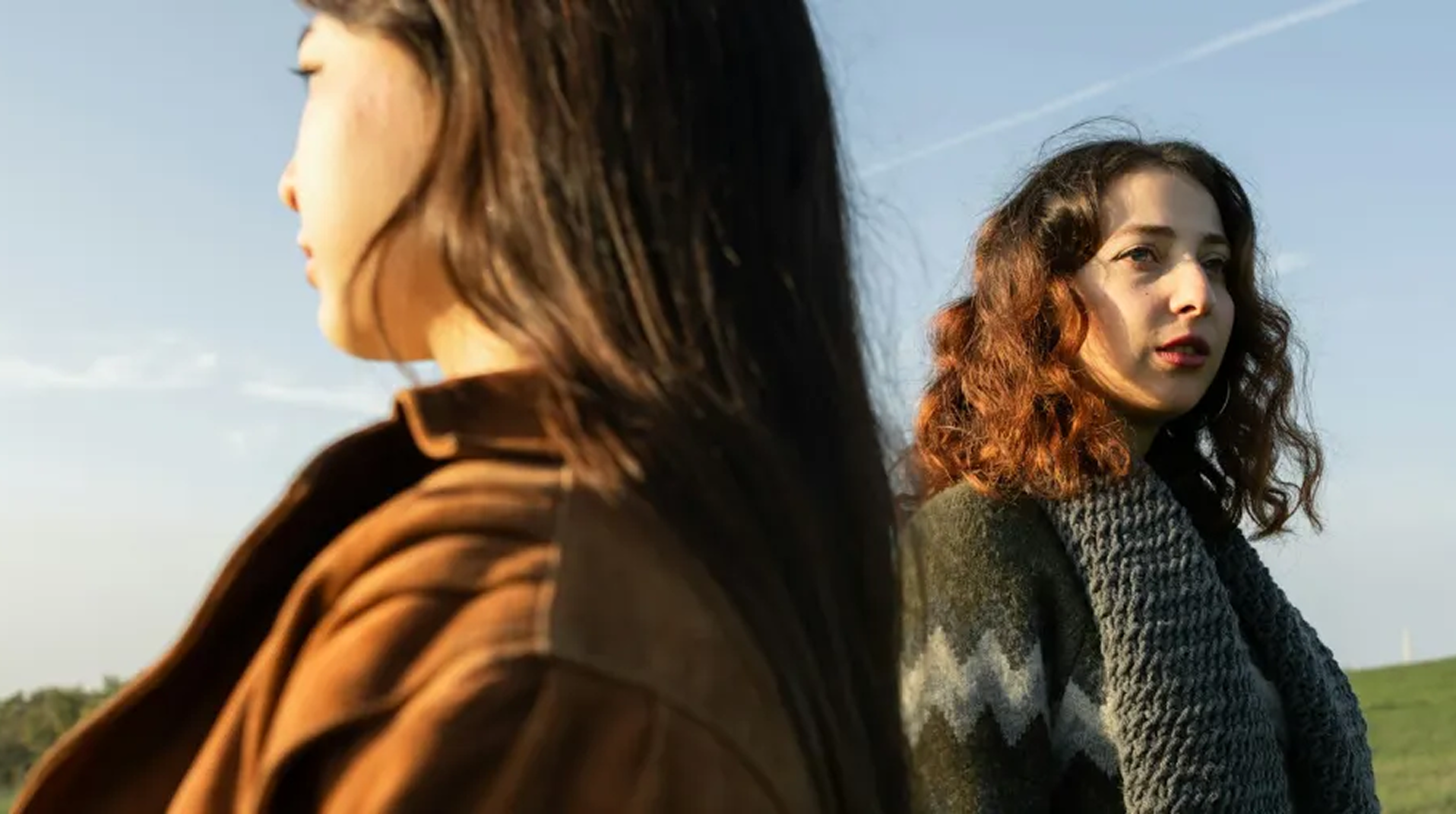 Two women looking in opposite directions