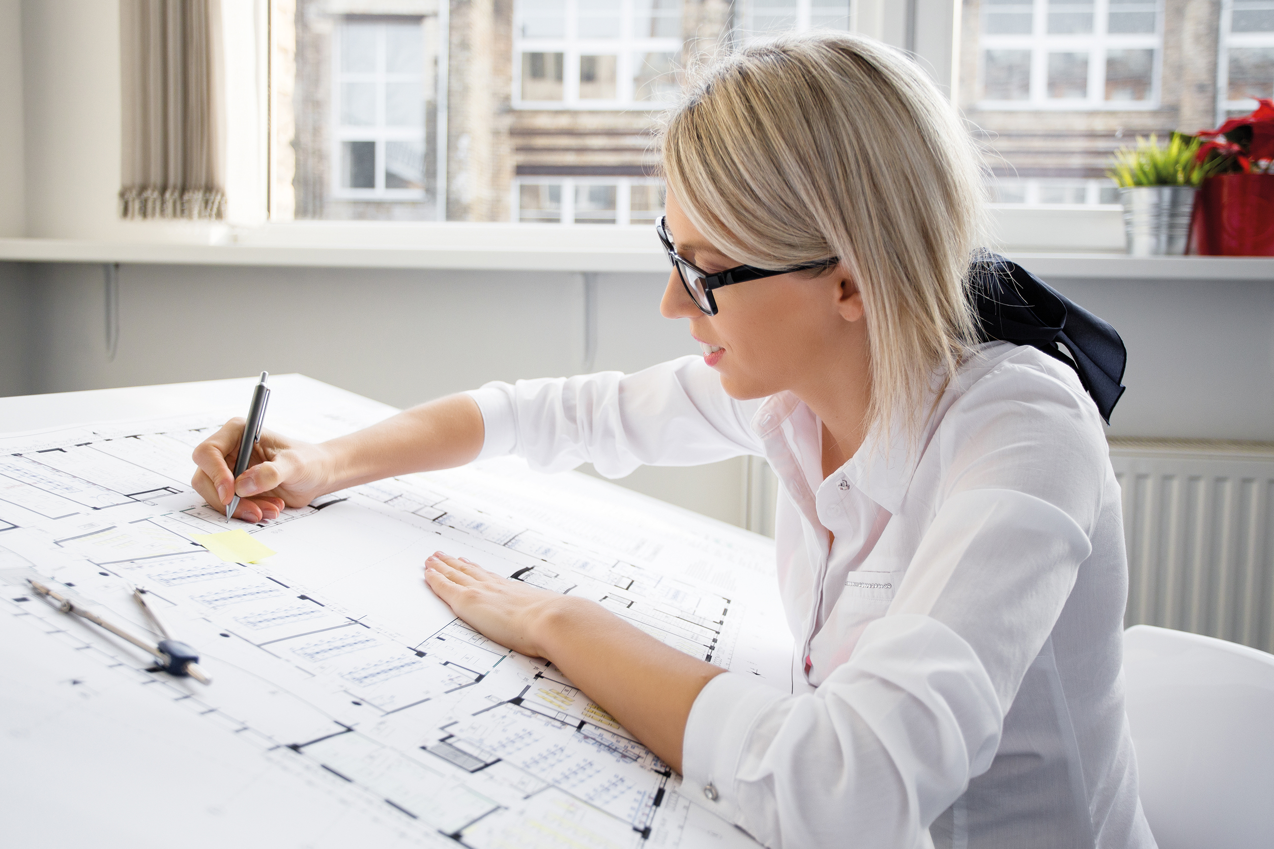 Architect working on building plans