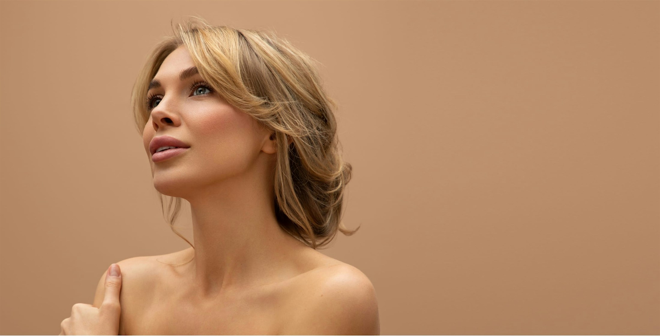 Pretty woman with blonde hair, styled