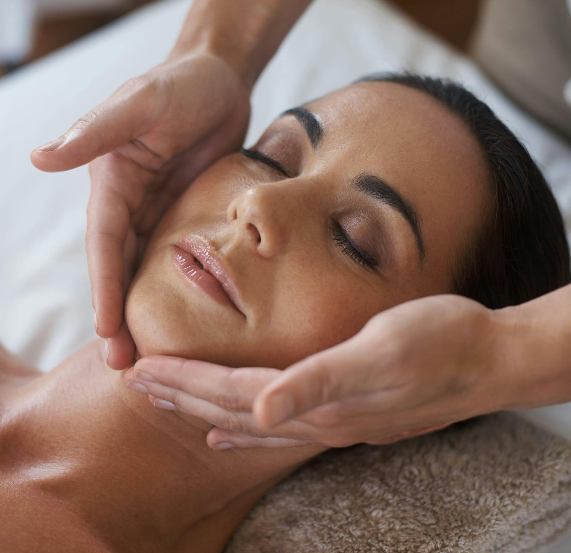 Woman Receiving Facial Treatments