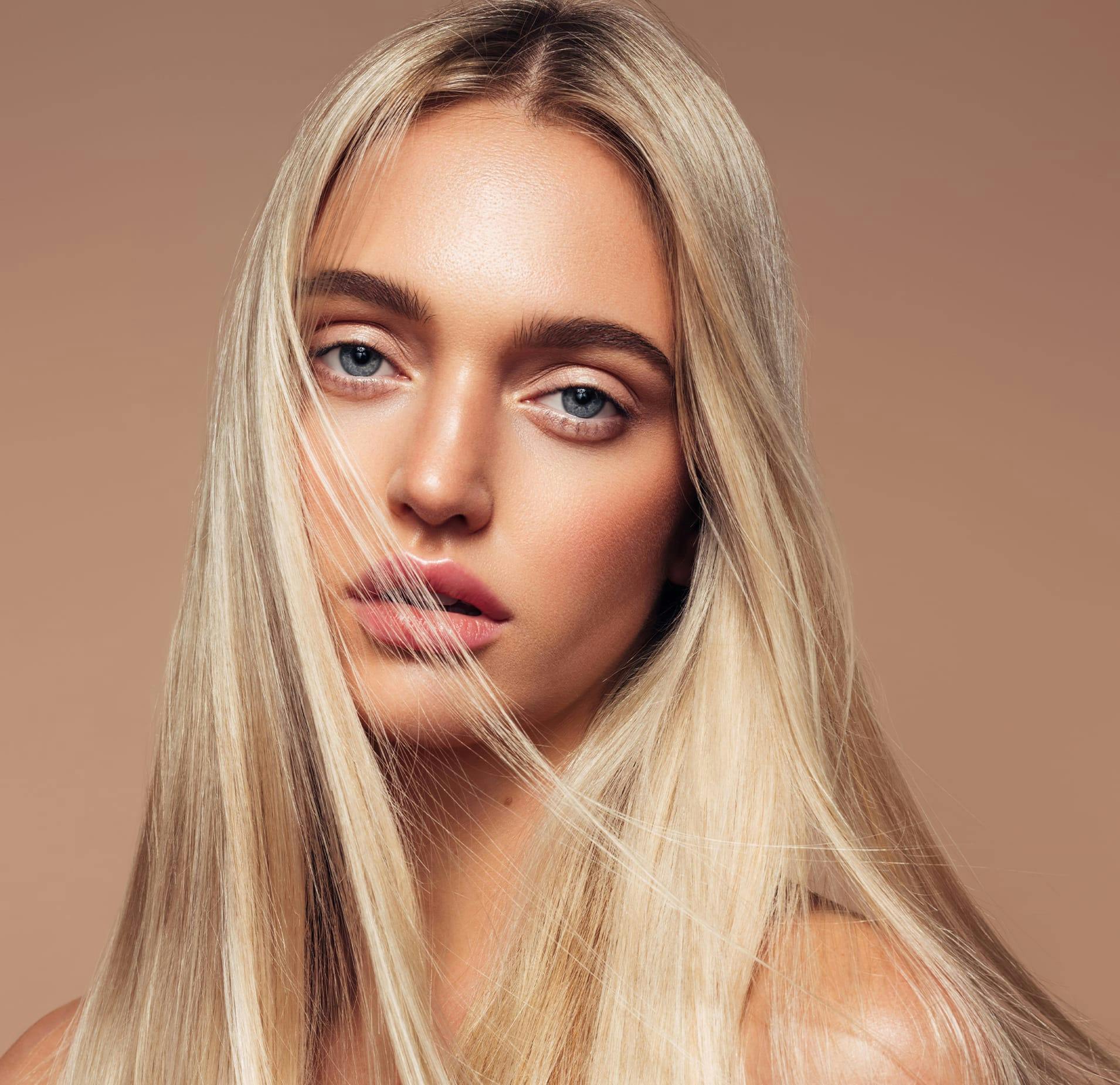 Woman with Long Blonde Hair Partly covering her Face