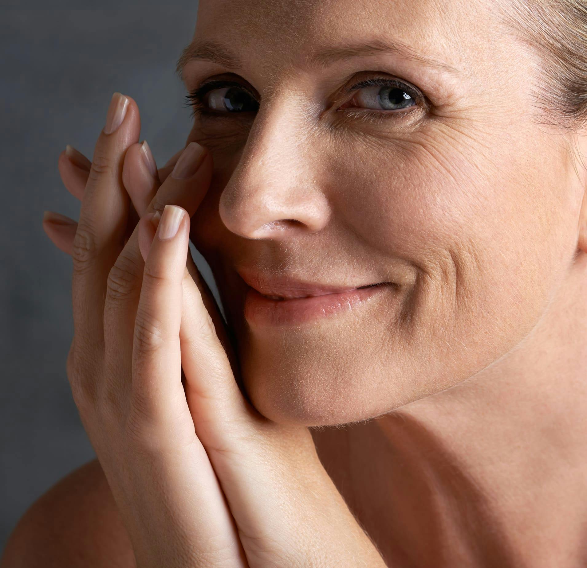 Woman with Hands Crossed near her Face