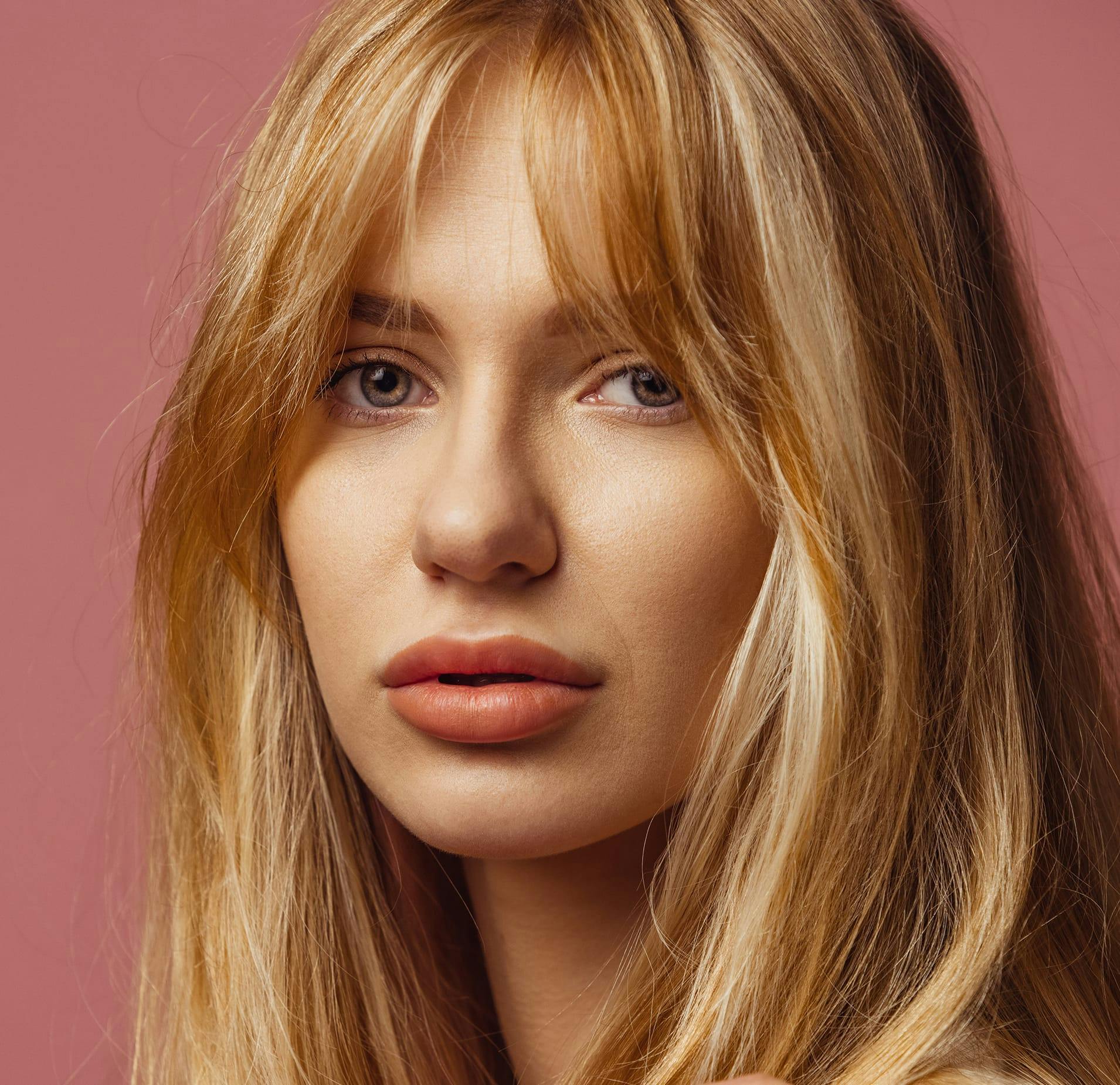 Woman with Bangs looking at the Camera