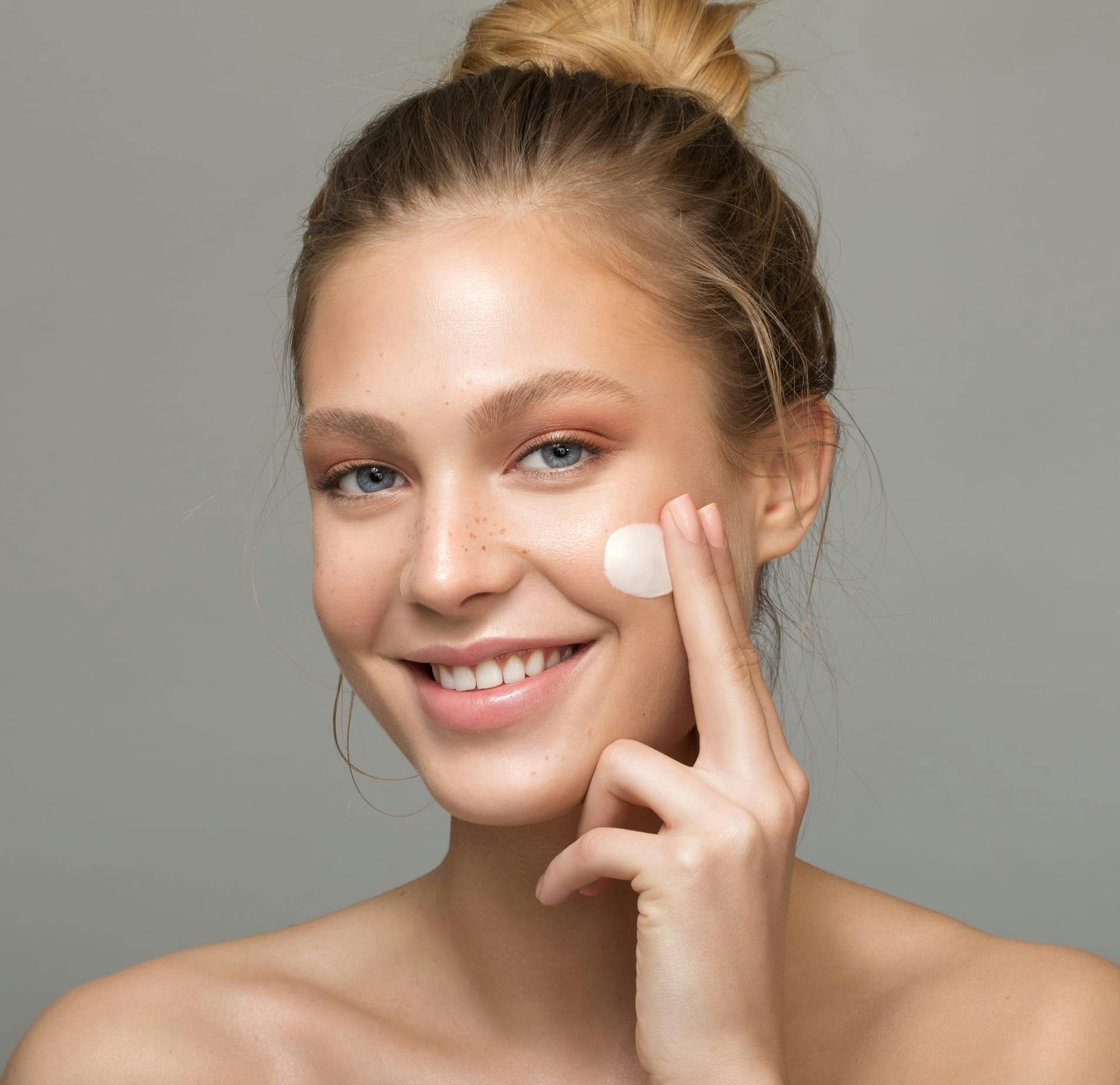 Woman Applying Cream to her Face