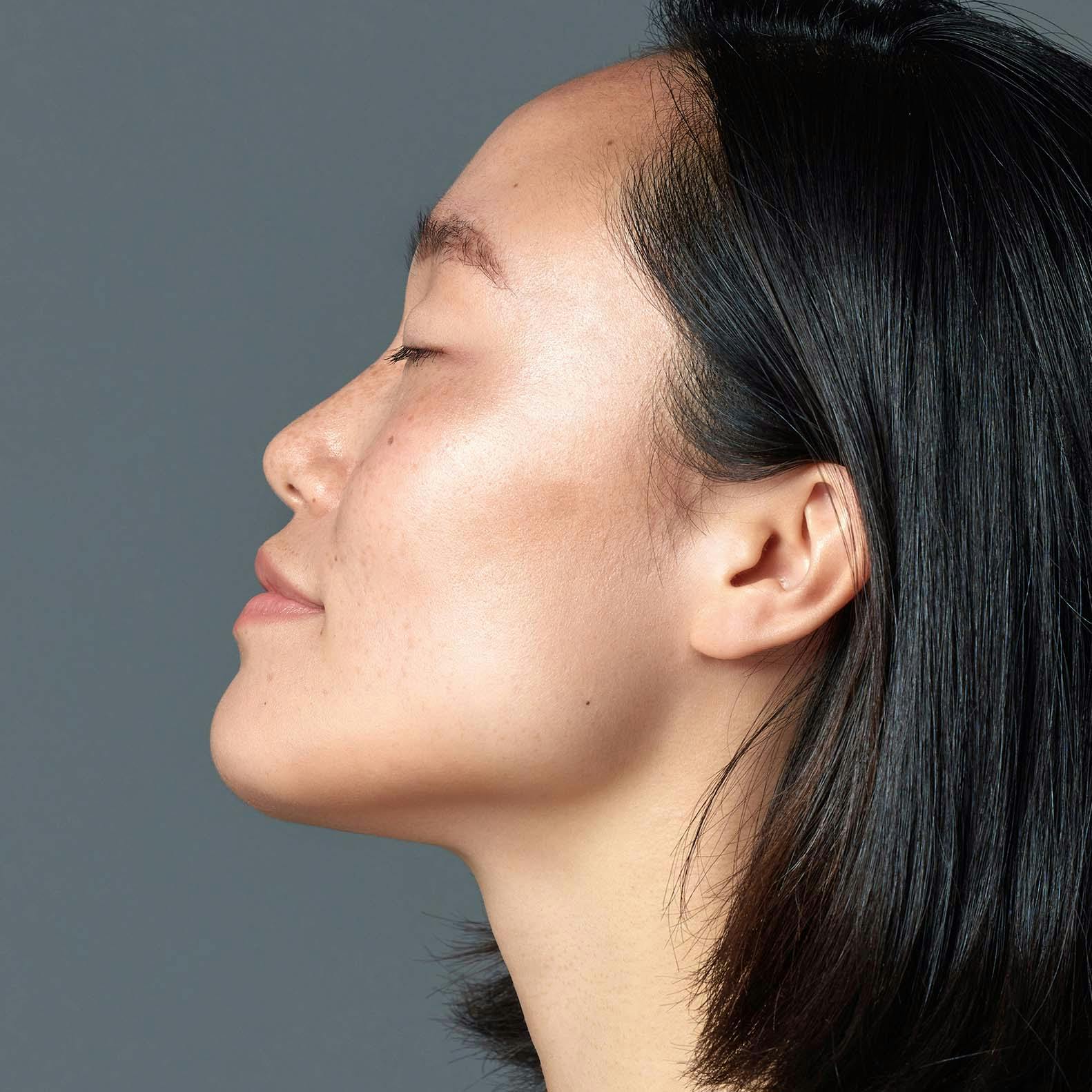 Side profile of females face with her eyes closed