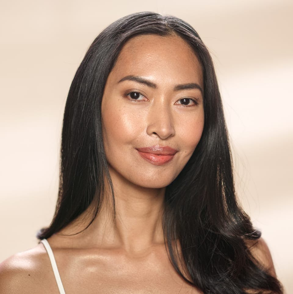 Beautiful woman with long black hair, smirking