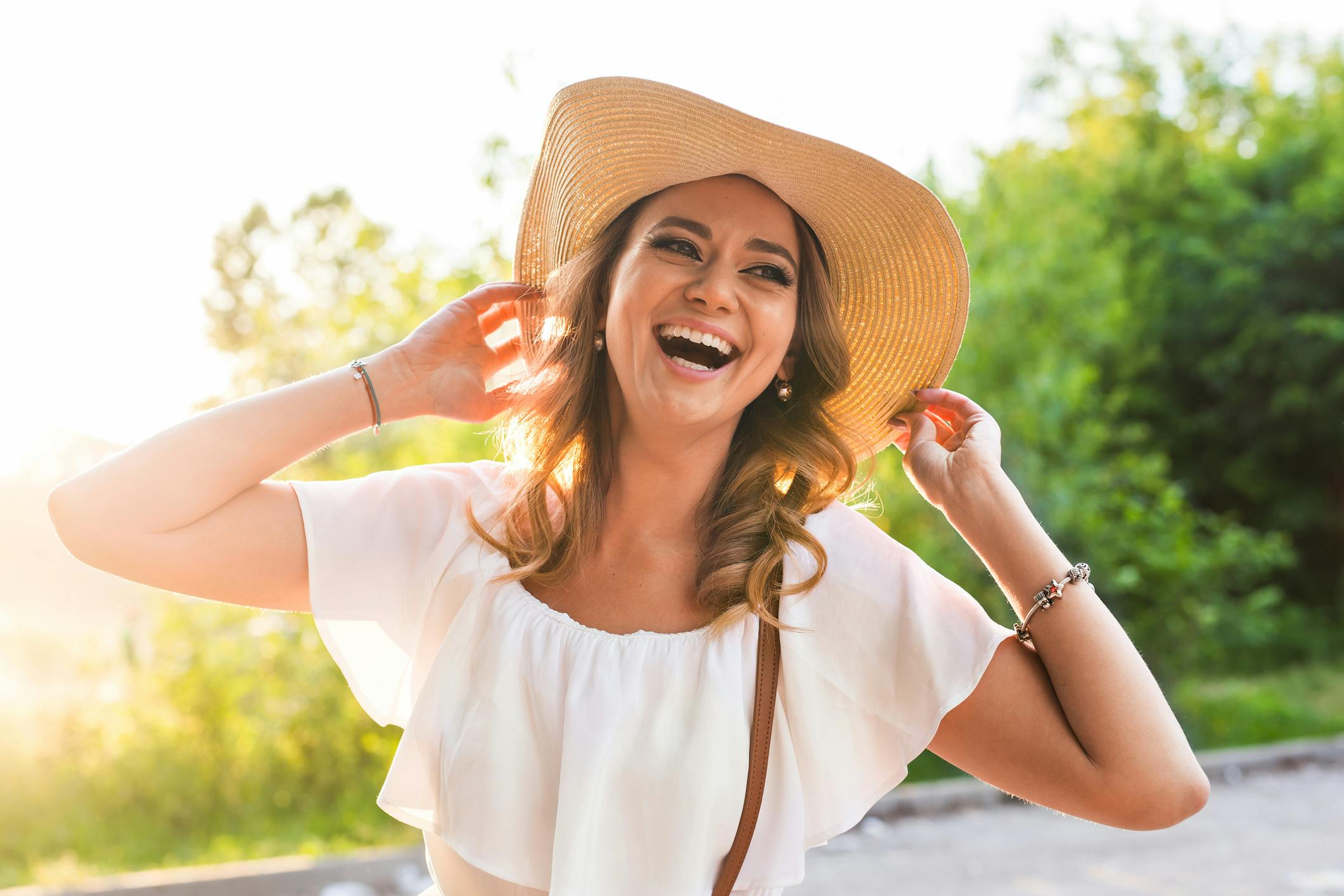 Happy woman laughing in sun