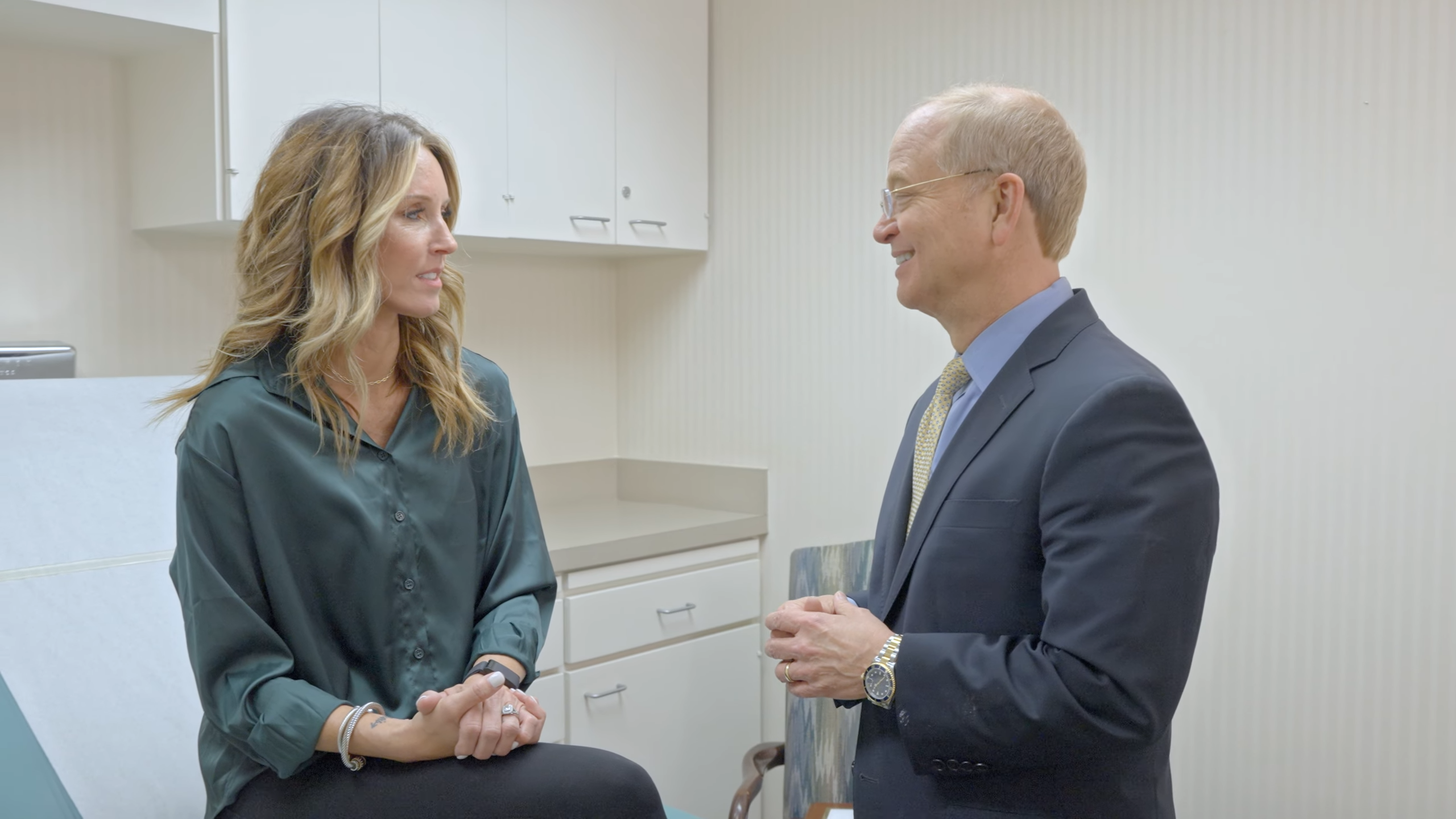 Dr. Pruitt speaking with a female patient