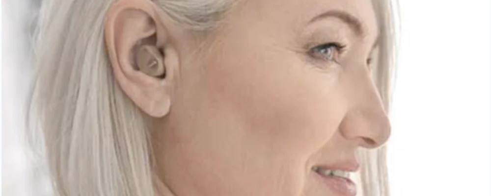 Older woman with hearing aid