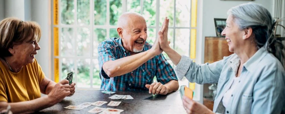 Older man and women playing poker