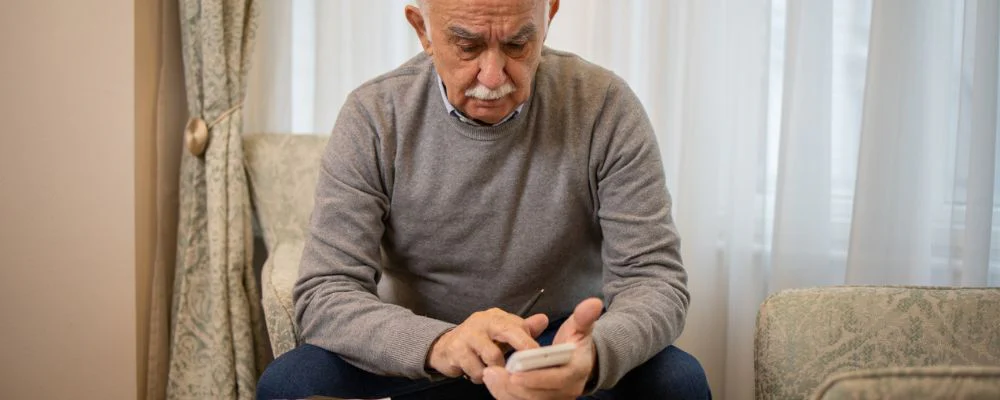 Older man calculating expenses