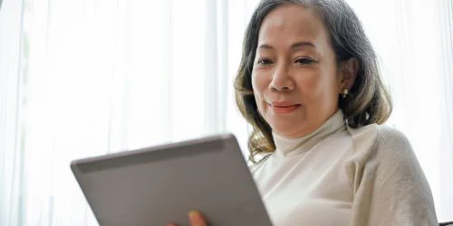 older woman using a tablet