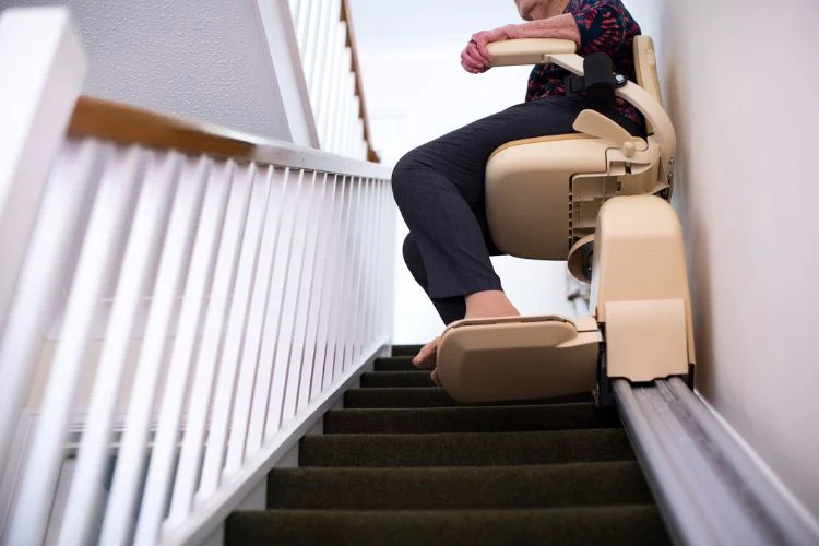 Woman moving up and down stair lift