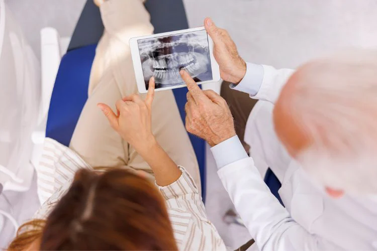 Doctor and patient looking at photo