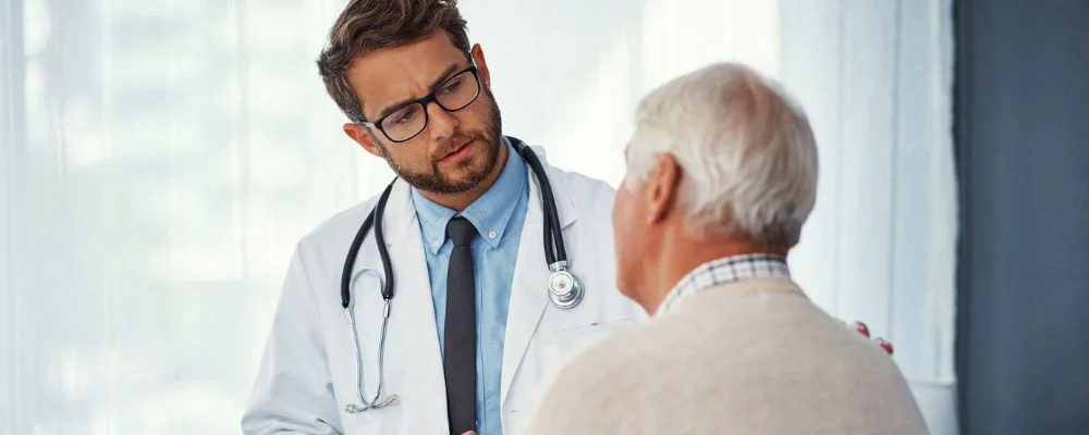 Man talking to doctor about cardiac ablation treatment option