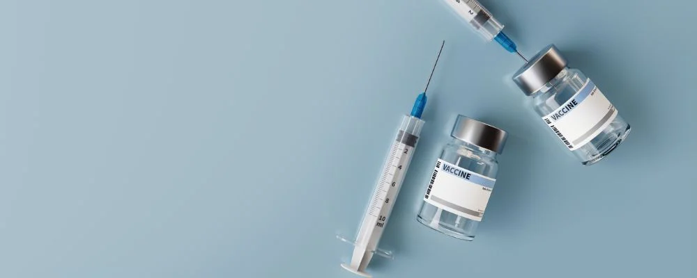 Image of two vaccine syringes