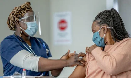 Woman receiving COVID vaccine