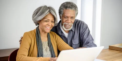 Older couple looking at computer screen