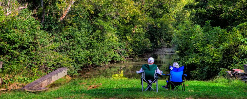 Senior couple sitting amongst nature in Potomac, Maryland