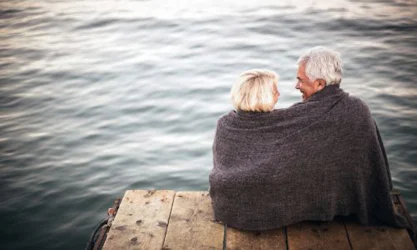 older couple sitting on dock in virginia