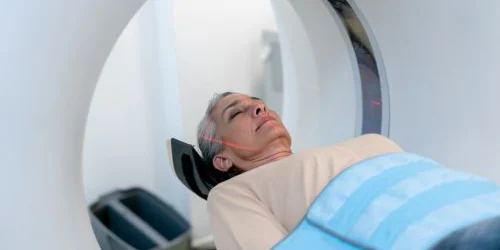 Woman lying down for CT scan