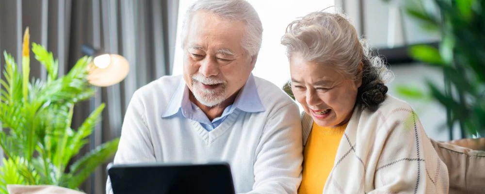 Senior couple looking at info on tablet