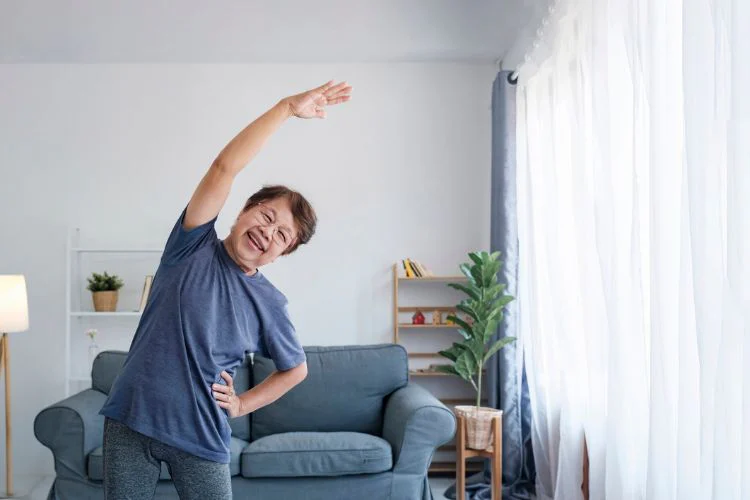 Woman stretching in living room