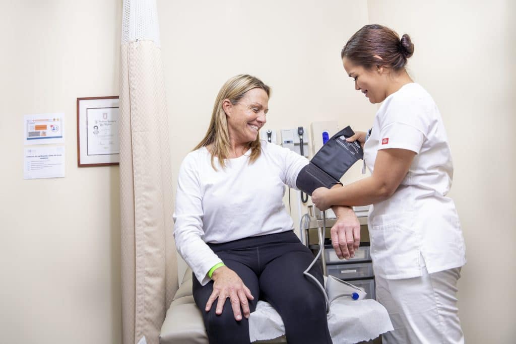 patient getting her blood pressure taken before her weight loss surgery in Tijuana, MX