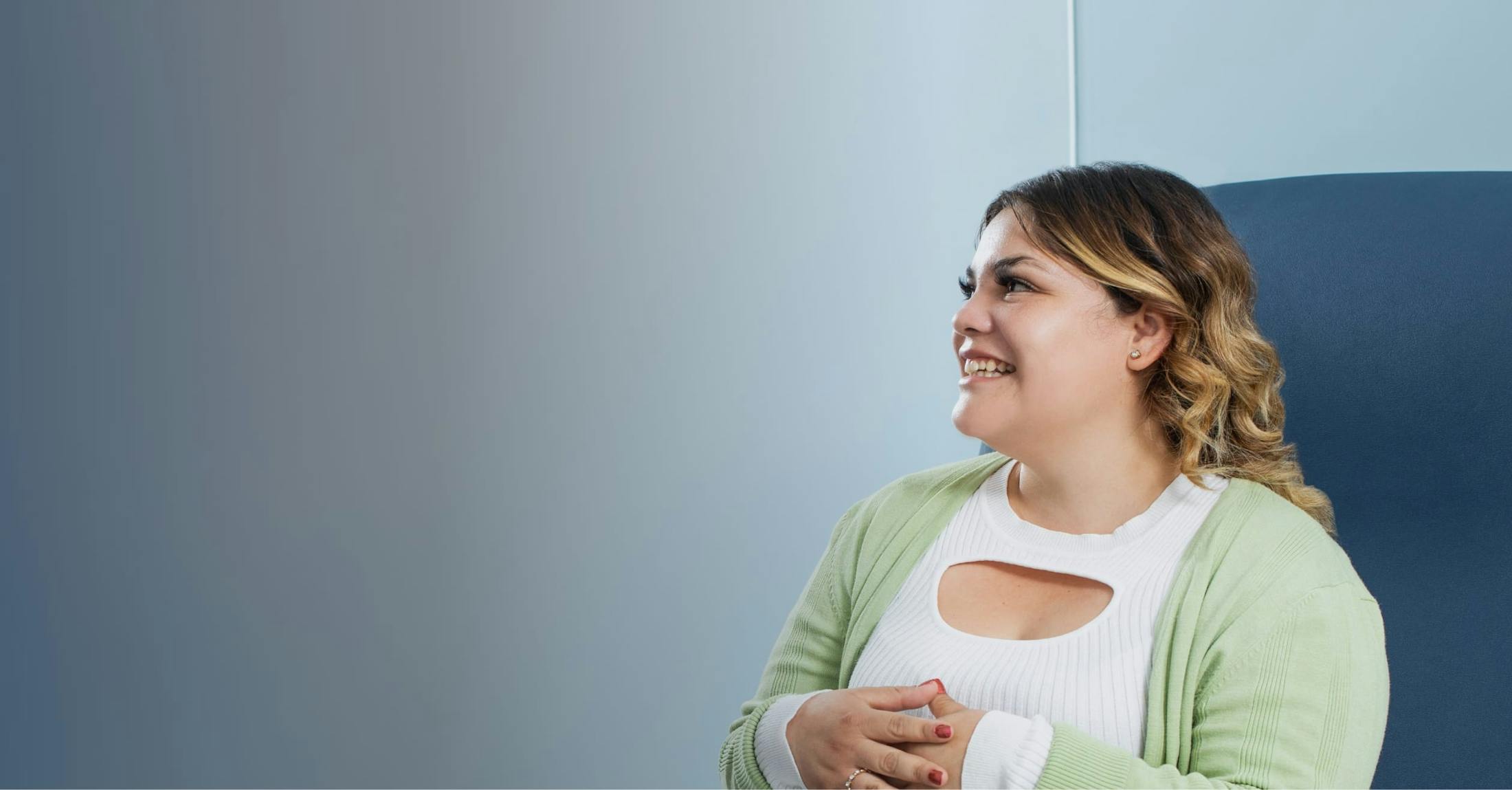 Woman sitting in chair smiling