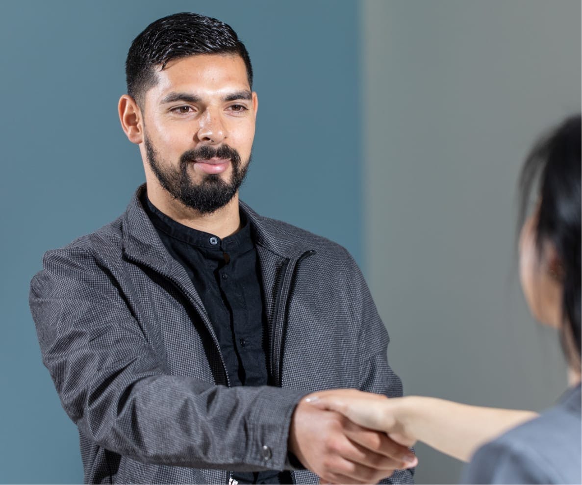 Man shaking hands with someone