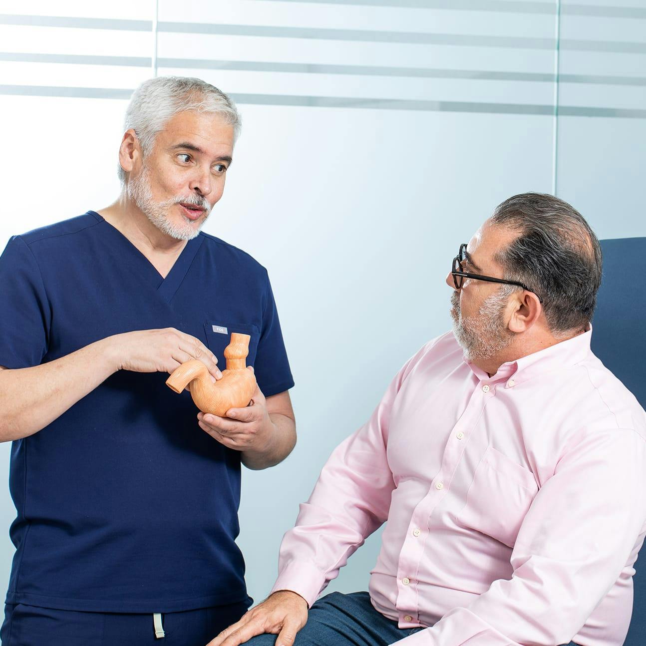 Dr. Oritz speaking with a male patient