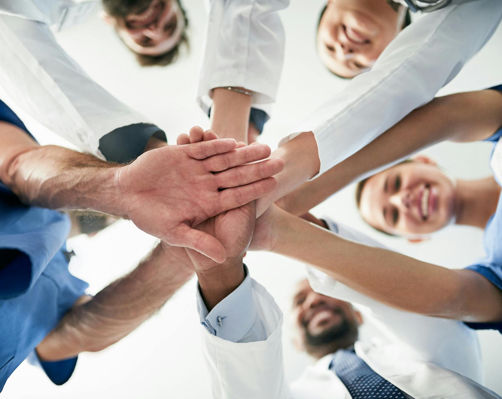 Doctors doing a team hand stack