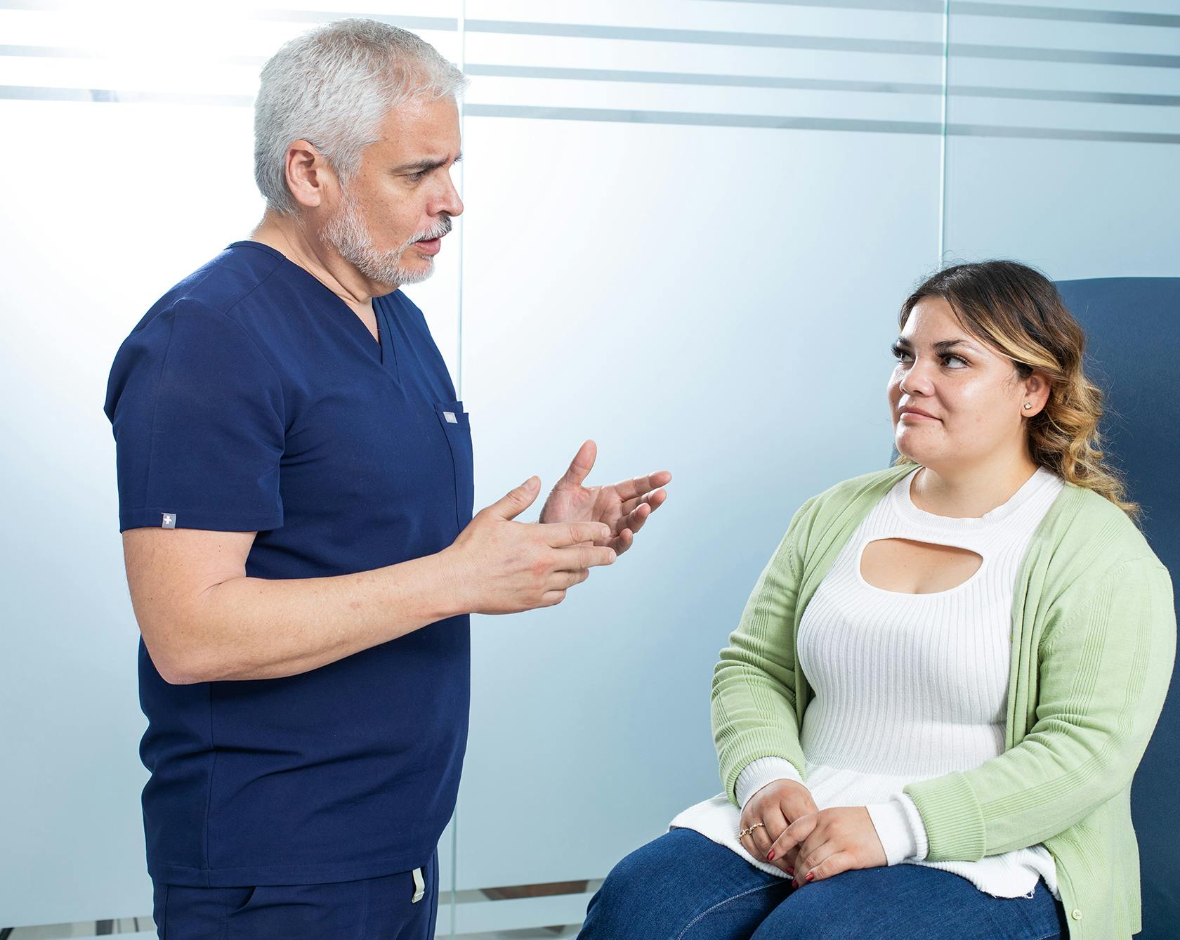 Female patient talking with a doctor at OCC about weight loss surgery options
