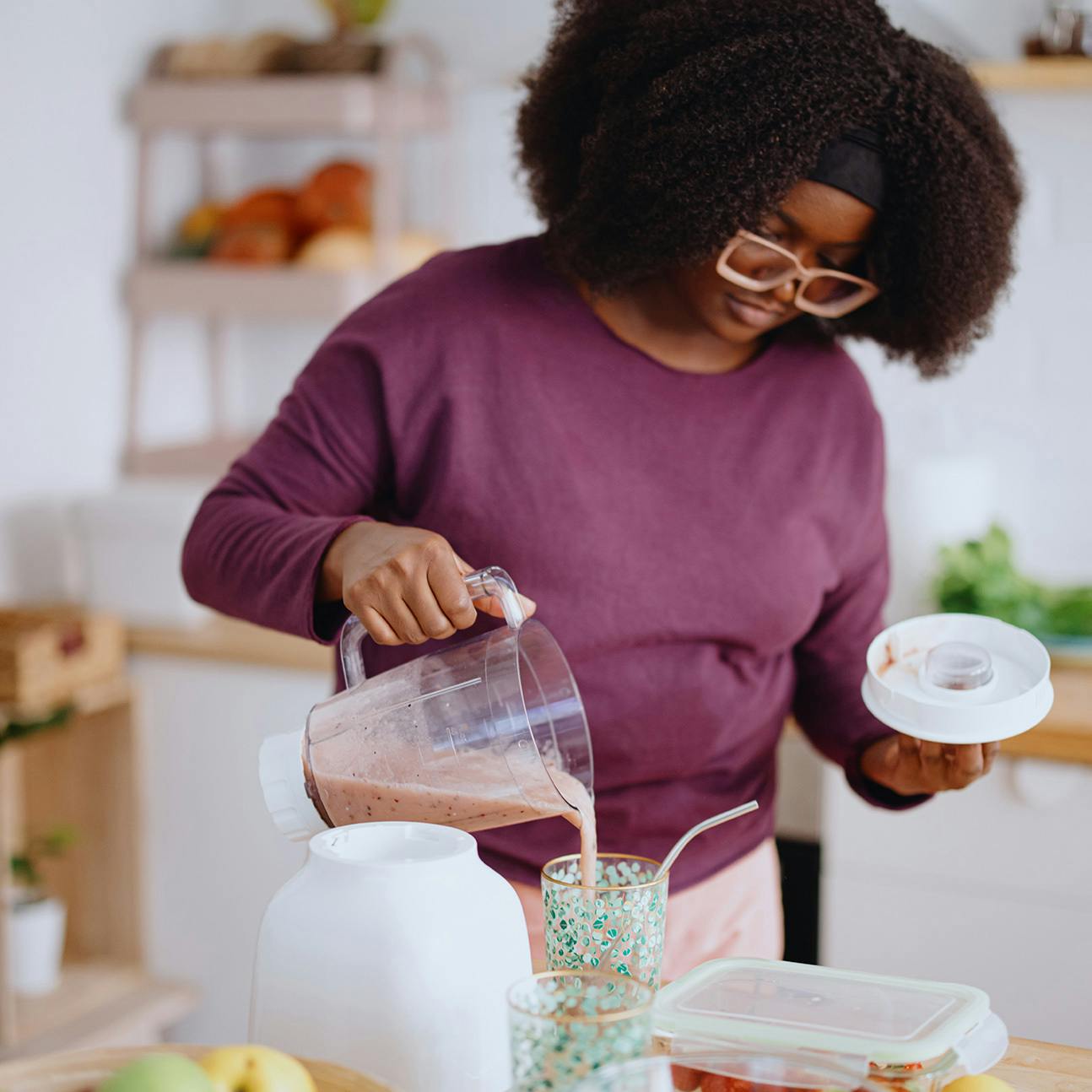 woman making a smoothie