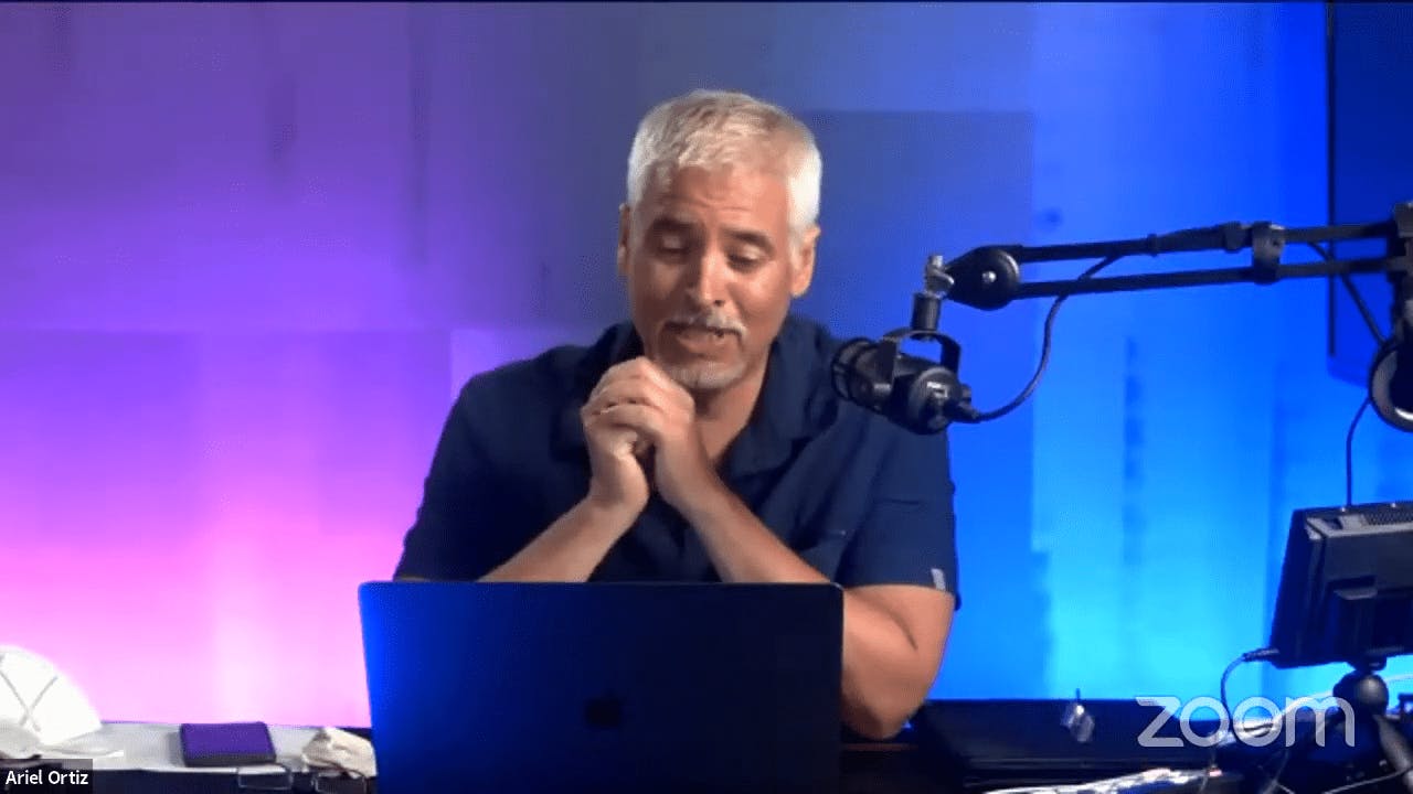 Man Speaking on a Microphone on a Podcast