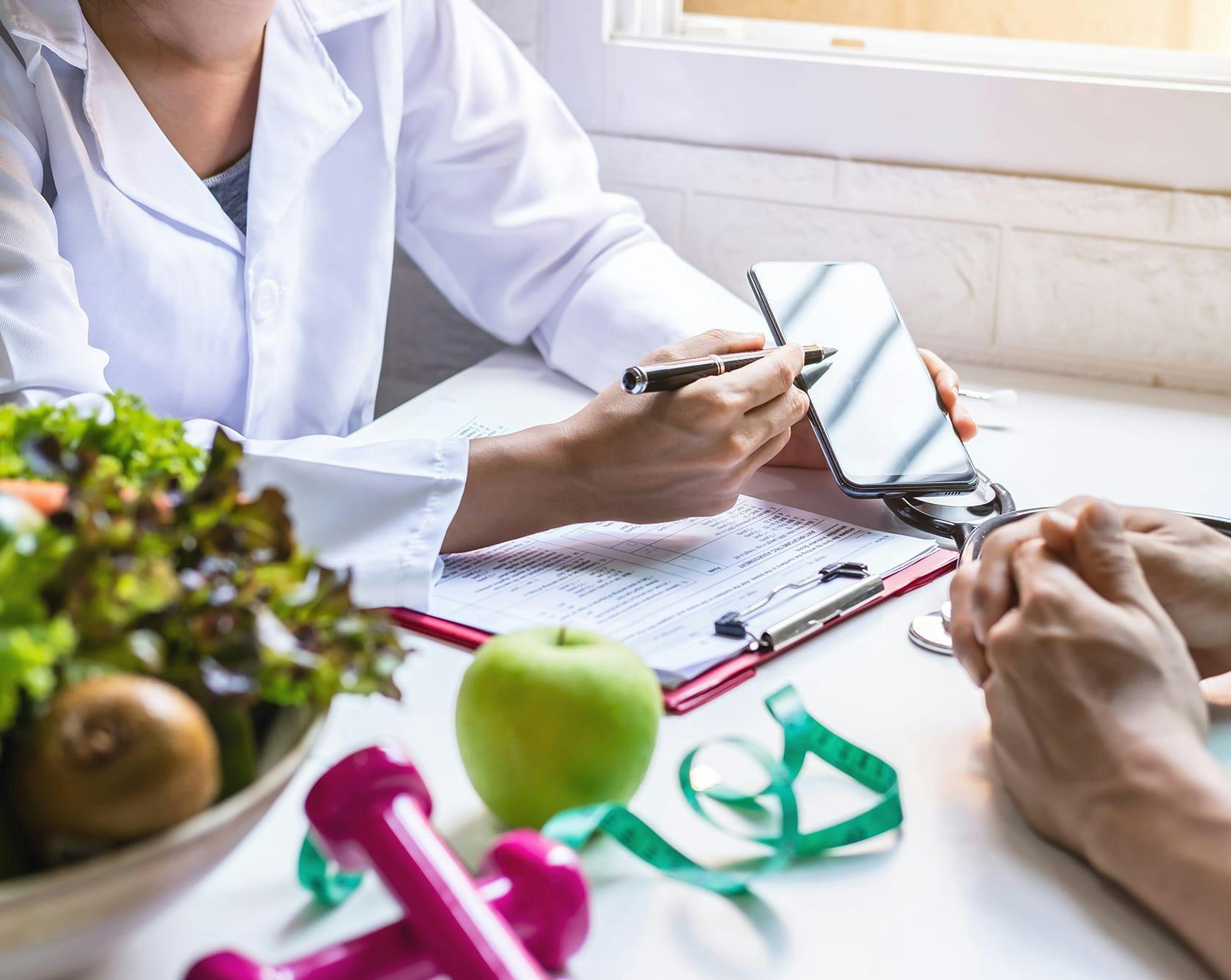 Nutritionist going over a meal plan with a patient