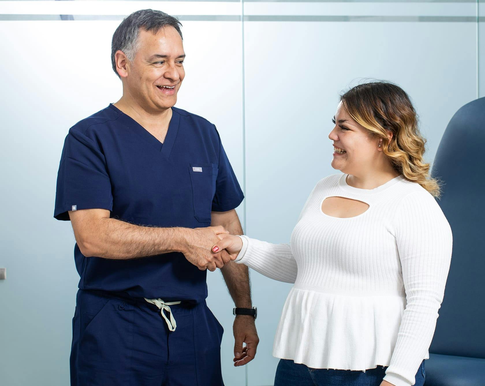 Female patient shaking doctors hand at OCC