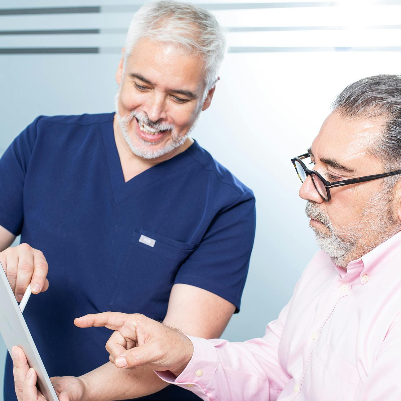 Dr. Ariel Ortiz speaking with a male patient