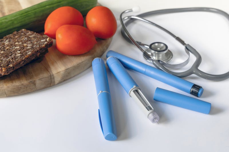 Ozempic injection with stethoscope and food
