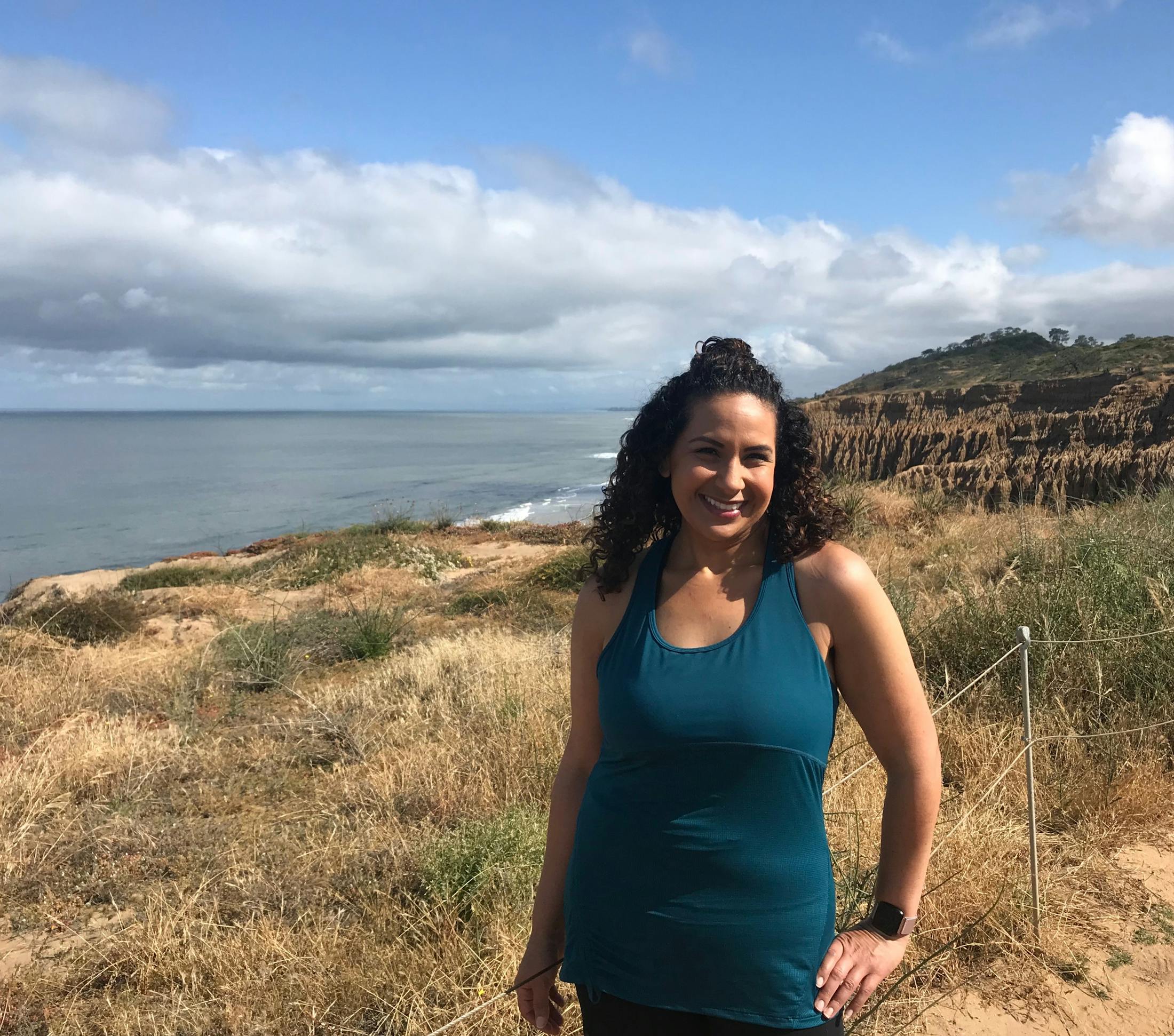 Carolina Standing on a Field by the Ocean