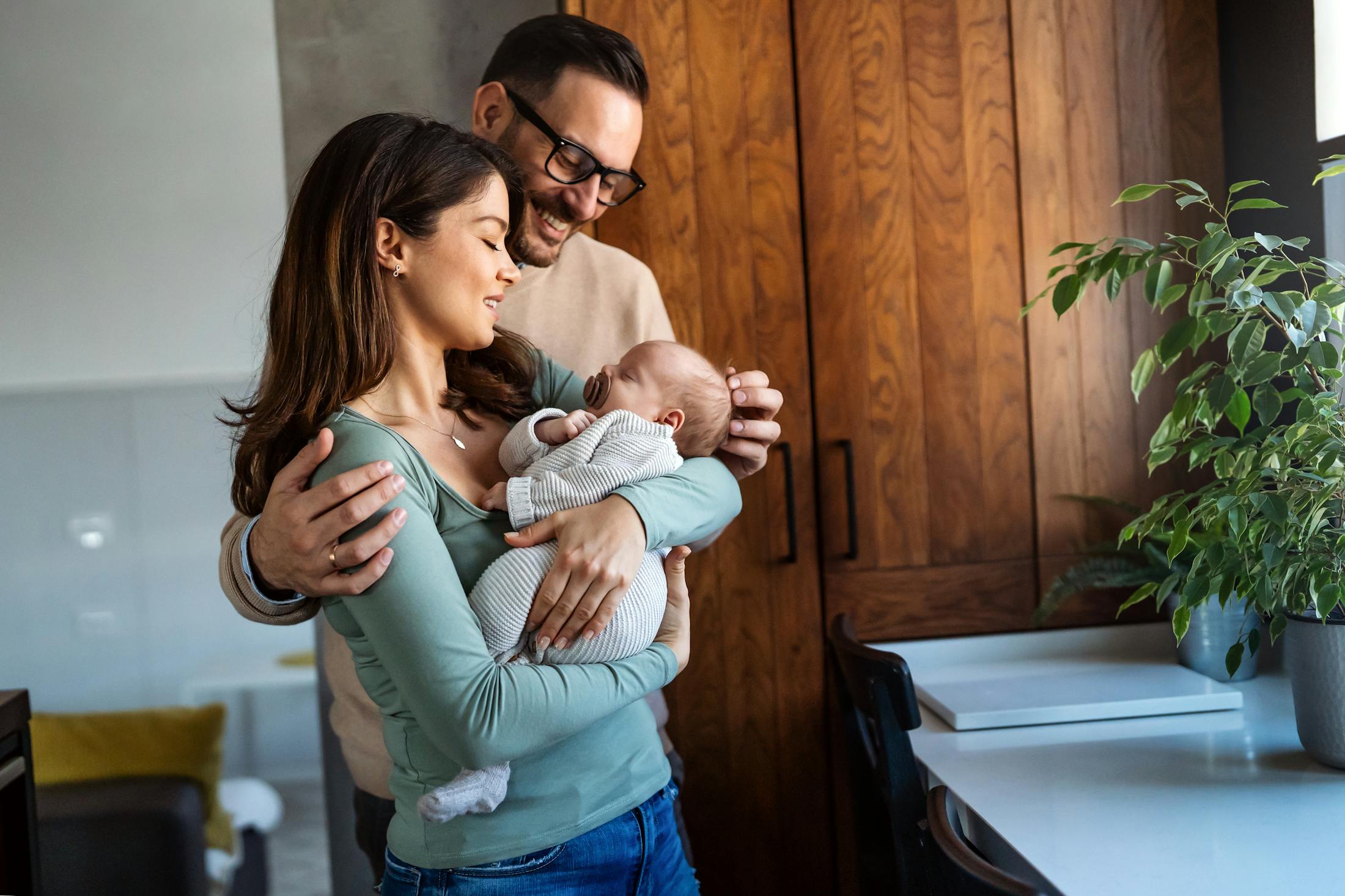 Father and mother holding a baby