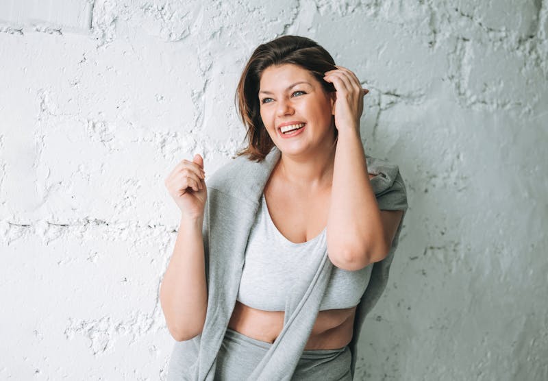 Woman tucking her hair behind her ear