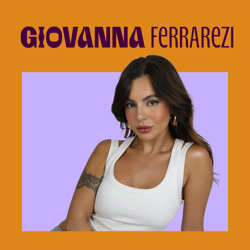 imagem traz foto da giovanna ferrarezi junto ao seu nome. giovanna é tem pele clara, uma tatuagem no braço esquerdo, cabelos escuros levemente ondulados abaixo dos ombros; veste uma regata branca e brincos dourados de argola largos.