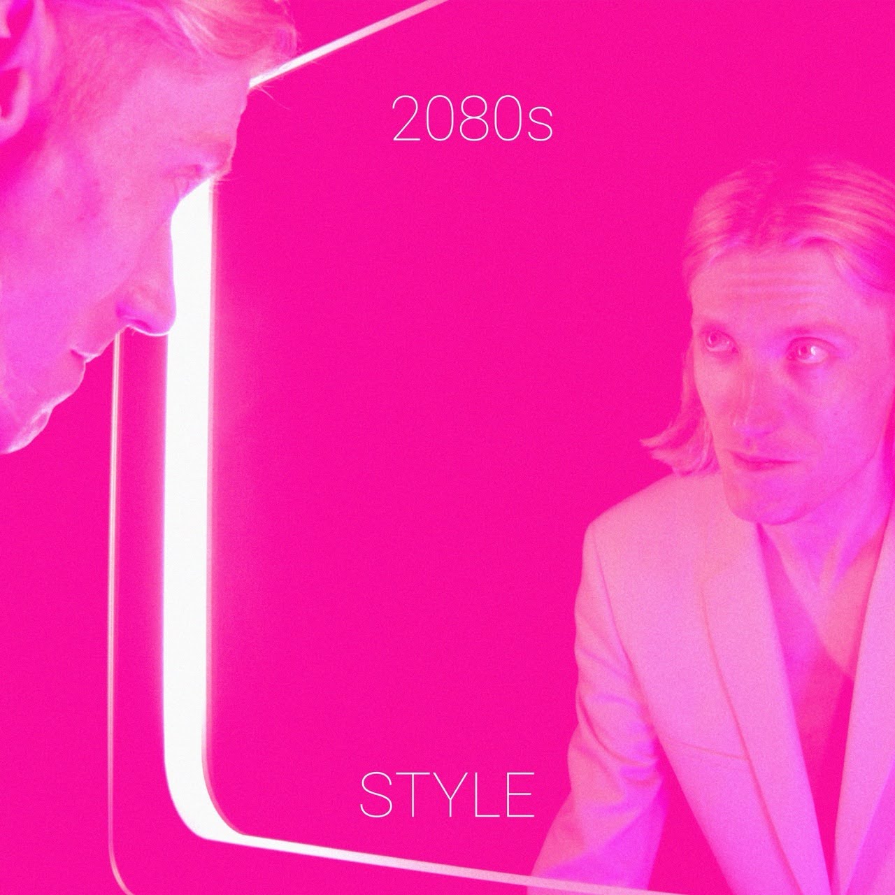 Man looks in mirror