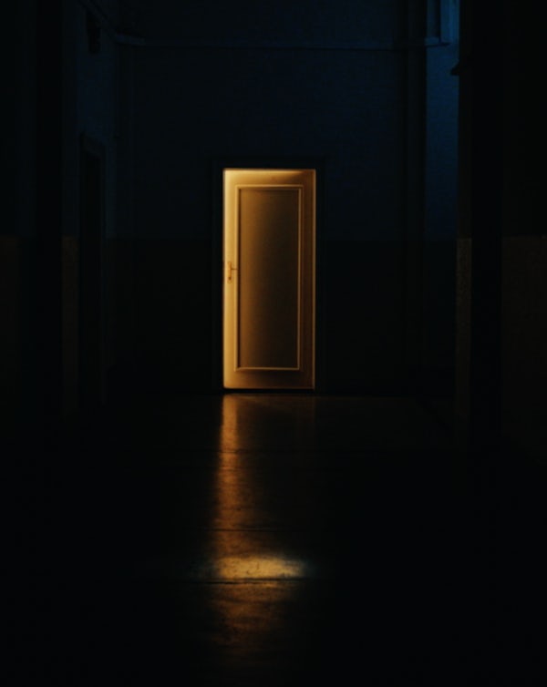 Gold light pierces the black through an open door—symbolizing cutting through the noise and finding legitimate gold sellers.