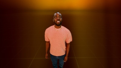 Man looking towards the camera with a look of interest on his face