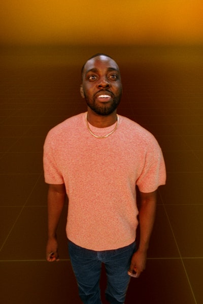 Man looking towards the camera with a look of interest on his face