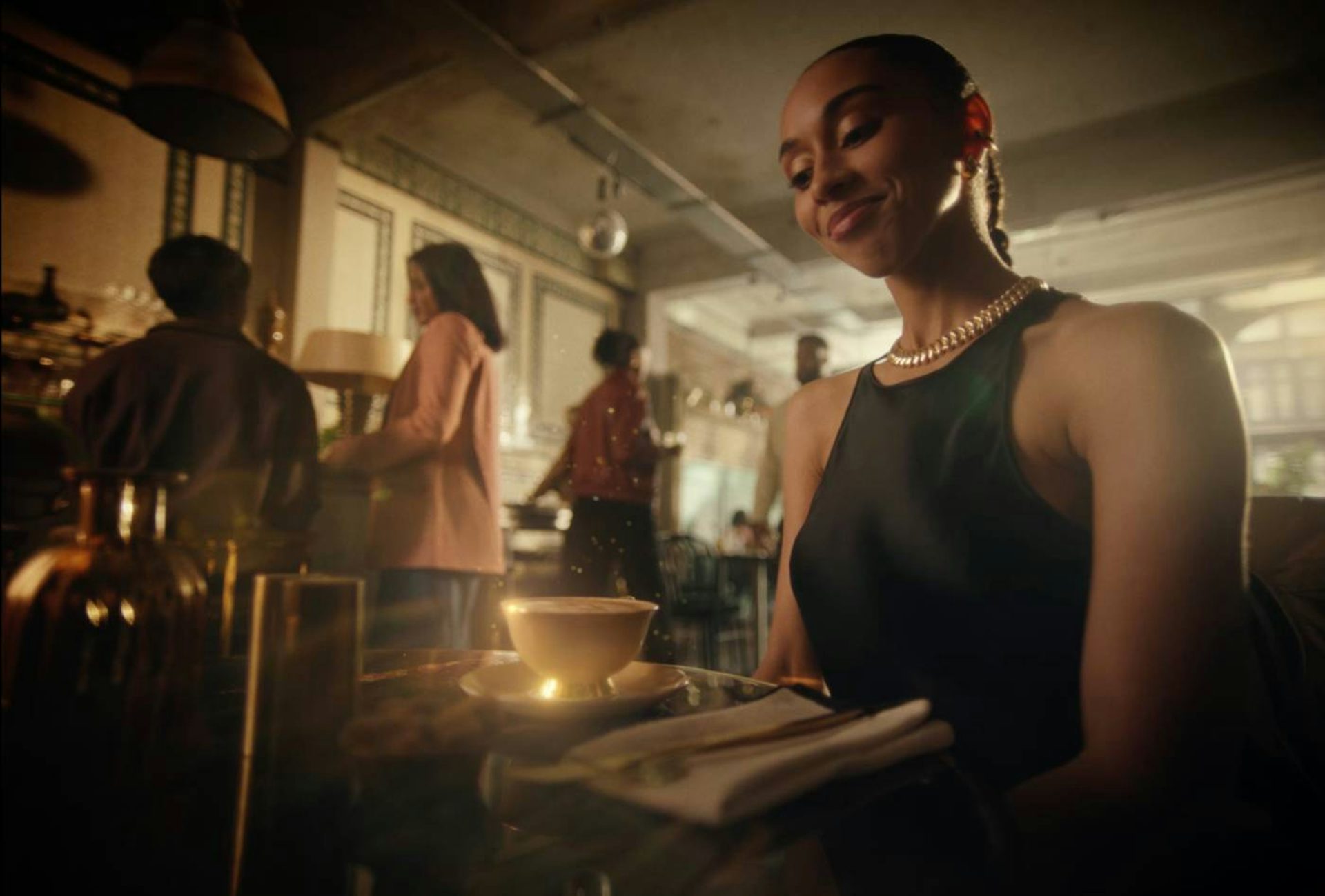 Lady at a table smiling